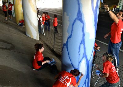 Lilly volunteers painting together