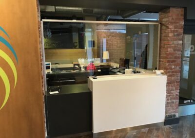 Modern office reception area with brick accents.