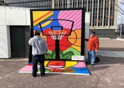 Gary Gee and Andrew Hanstings in front of basketball mural