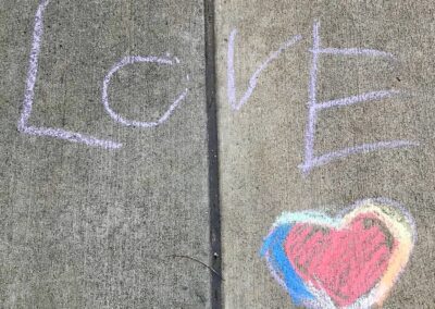 "LOVE" in chalk on sidewalk