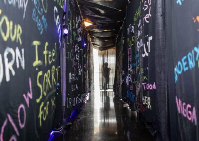 Long hallway with insults written down each side