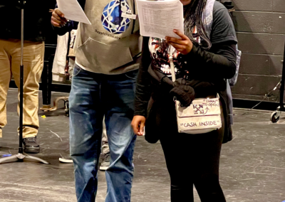 Actors reading scripts during rehearsal