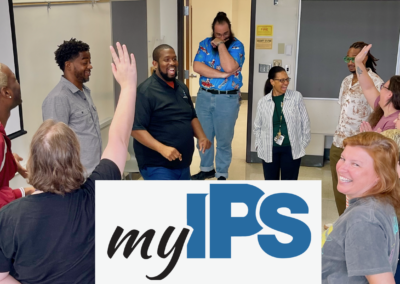 People in team building circle with myIPS logo